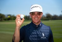 Sean Foley holding a Maxfli golf ball