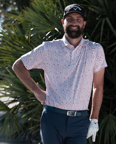 Josh Kelley posing with golf club in hand